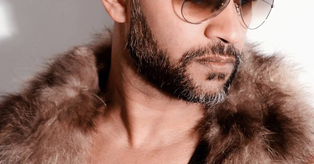Fashion-forward man wearing a fur coat and sunglasses, exuding style.