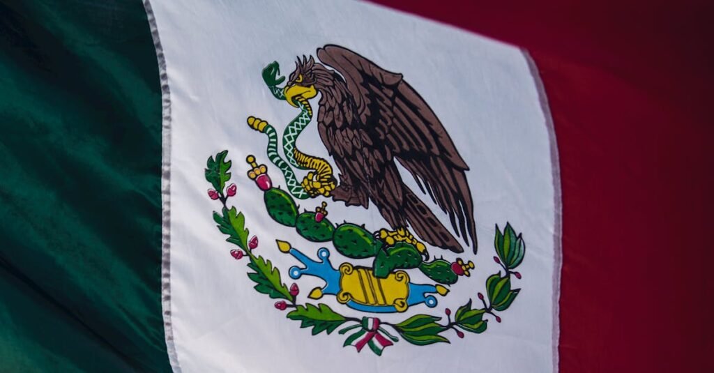 Detailed close-up of the Mexican flag showcasing its vibrant colors and emblem.