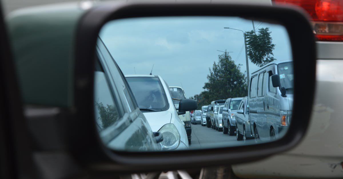 Reflection of a busy traffic jam in Nairobi captured through a car's side mirror.