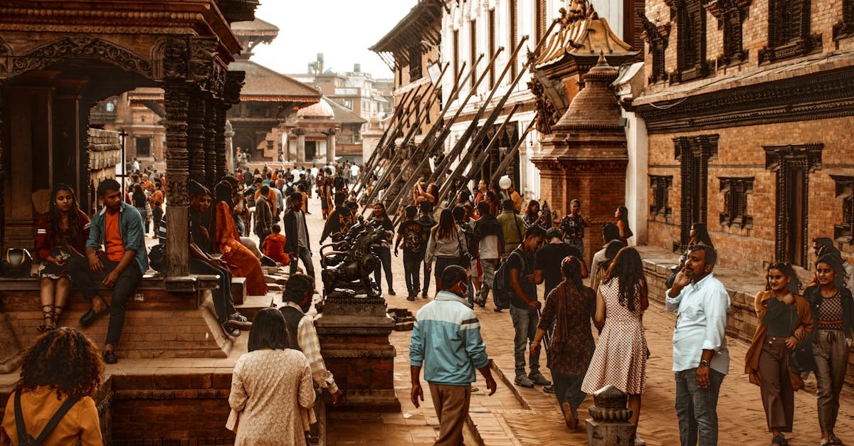 Vibrant street scene in Kathmandu, Nepal showcasing historical architecture and a diverse crowd.