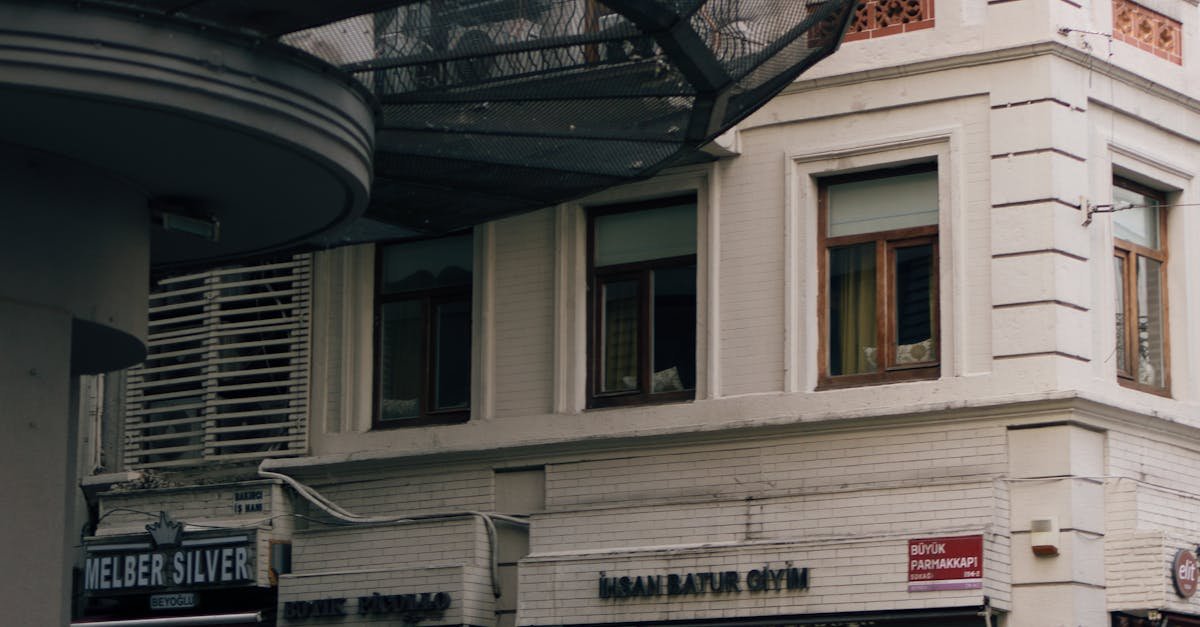 A yellow taxi parked at a historical street corner in Istanbul, showcasing classic architecture.