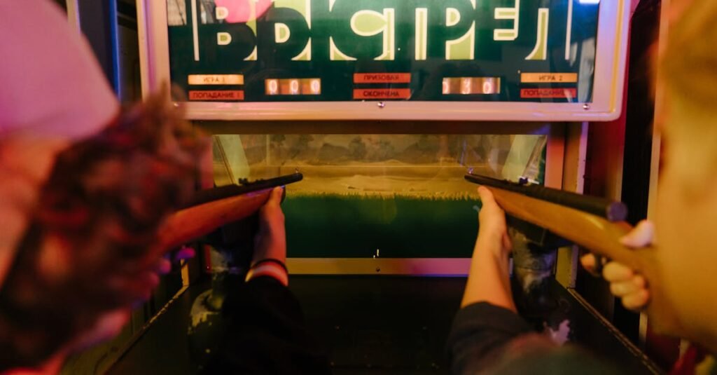 Teenagers having fun playing a vintage arcade shooting game with rifles at an amusement park arcade.