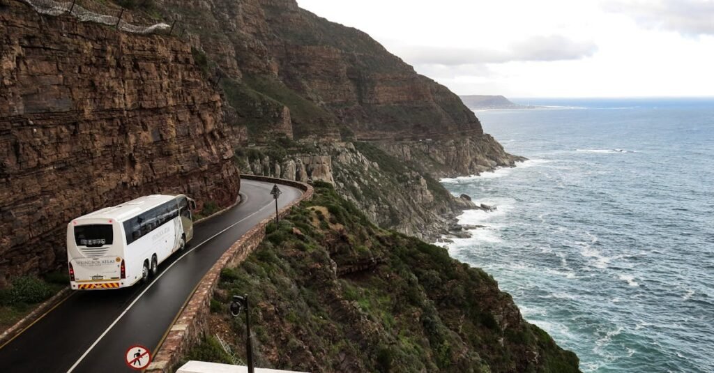 A scenic road trip along dramatic coastal cliffs in South Africa, ideal for travel and adventure.