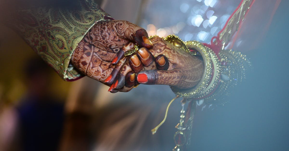 A beautiful capture of mehndi-decorated hands symbolizing love and tradition in a wedding ceremony.