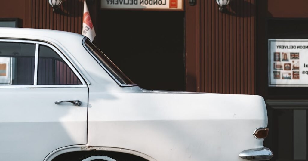 White vintage car parked on a İstanbul street with brick building backdrop.