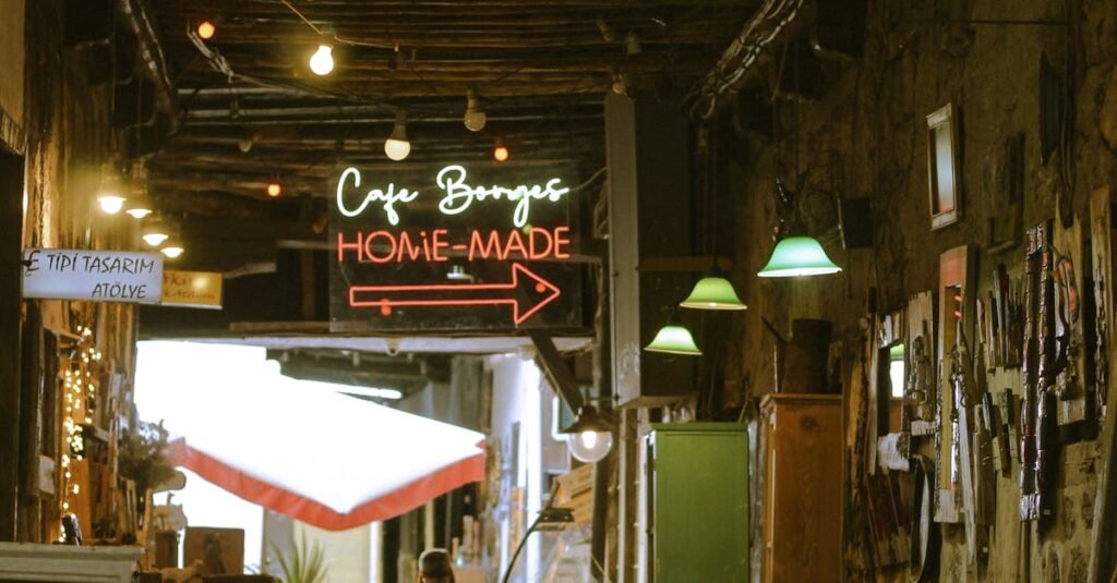 Explore a cozy, vintage café alley featuring retro decor and vibrant neon signs, perfect for a nostalgic experience.