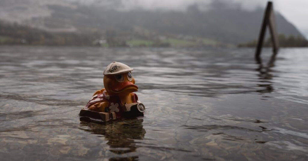 A cute rubber duck floats in a misty lake, evoking adventure and curiosity.