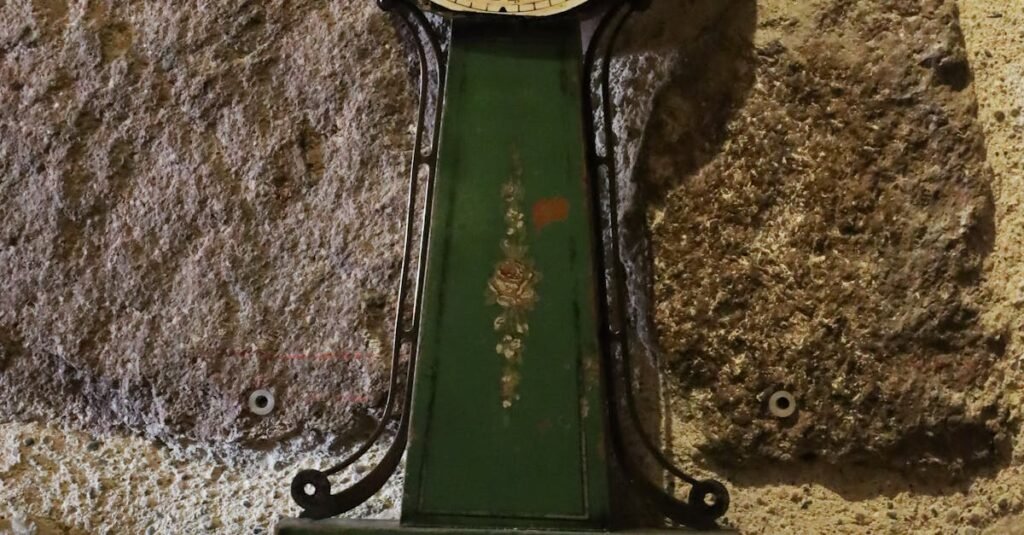 Antique decorative clock mounted on a rustic stone wall, Ankara, Türkiye.