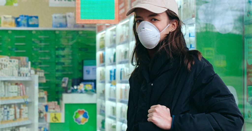 Woman in mask outside a pharmacy, with a bag and protective face mask, emphasizing health and safety.