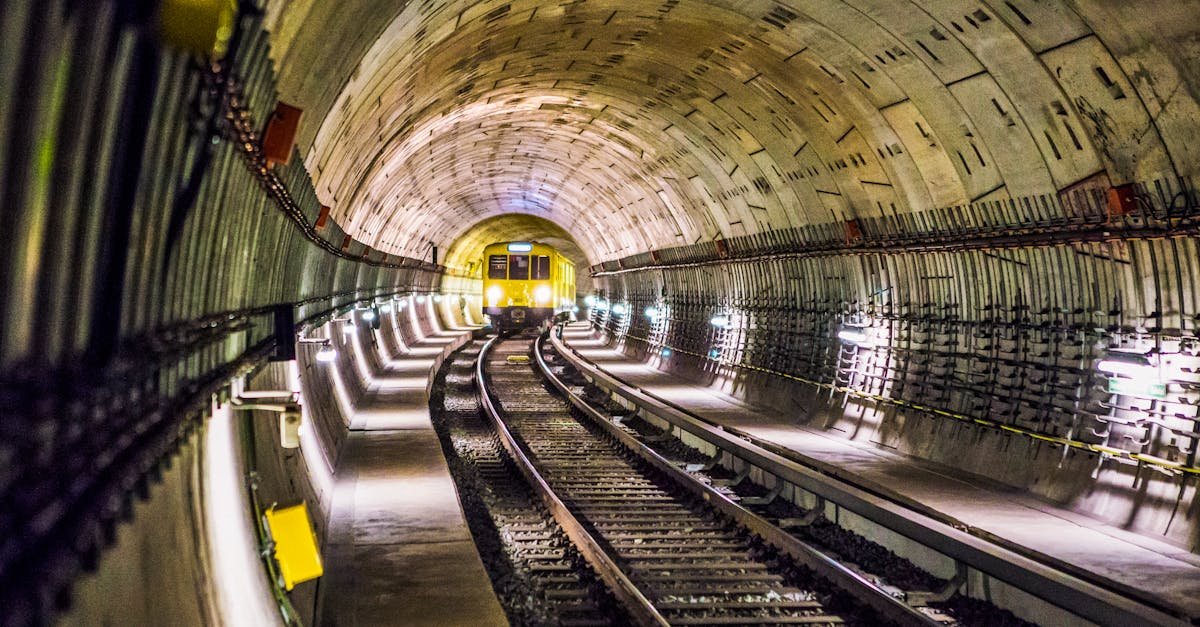 Dramatic view of a Berlin subway tunnel with train approaching, showcasing modern infrastructure.