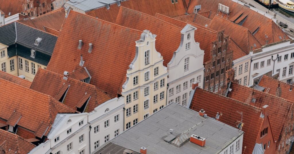 Explore the charming red-tiled rooftops of Lübeck's historic old town from above.