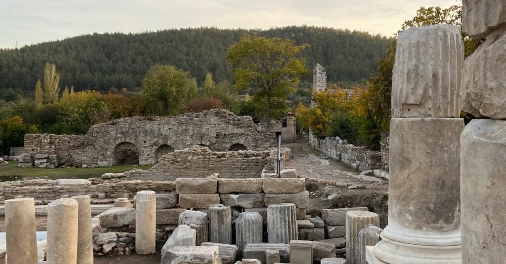 Explore the timeless beauty of ancient ruins amidst a serene natural backdrop in Yatağan, Türkiye.