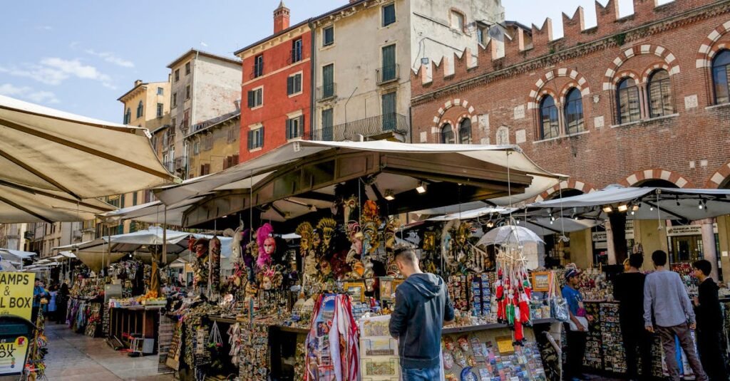 Lively street market scene in Verona, showcasing local crafts and architecture.