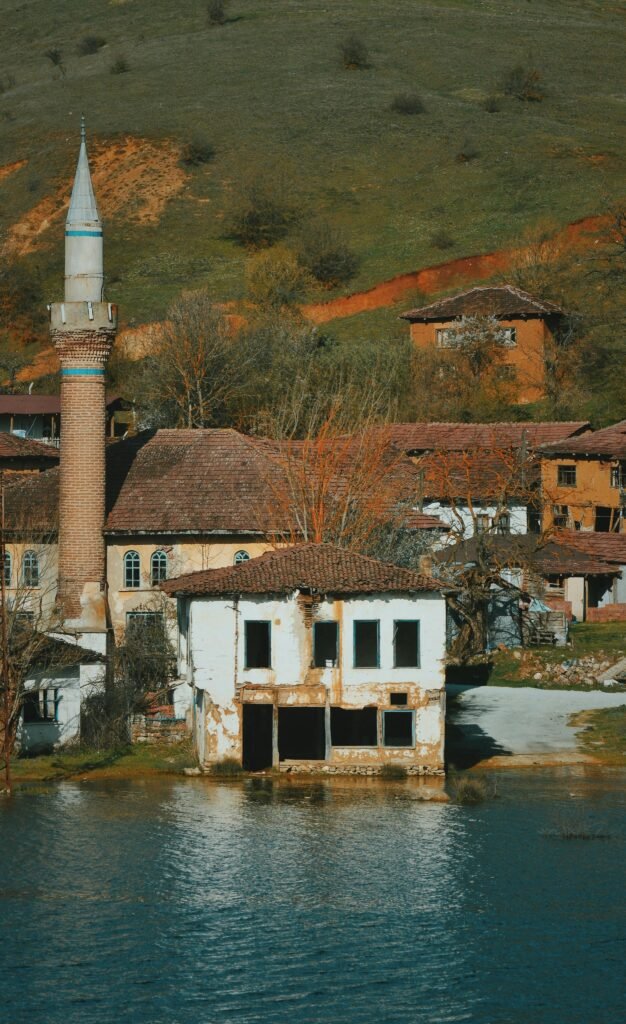 Explore a picturesque abandoned village in Bilecik, Turkey, showcasing a traditional minaret and rustic architecture.