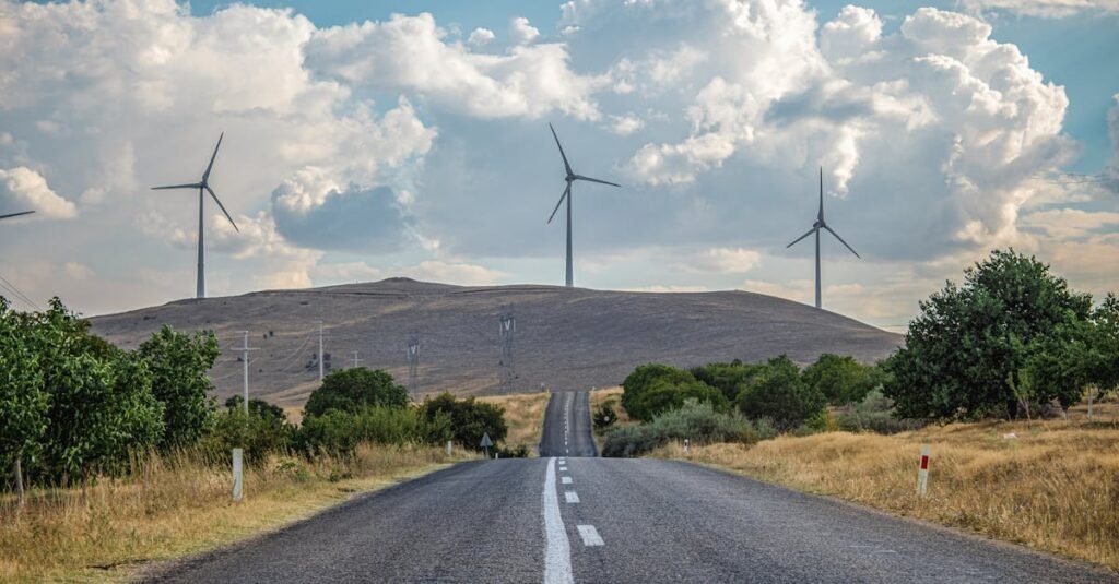Scenic view of wind turbines along a rural road in Kayseri, Türkiye, capturing the essence of renewable energy.