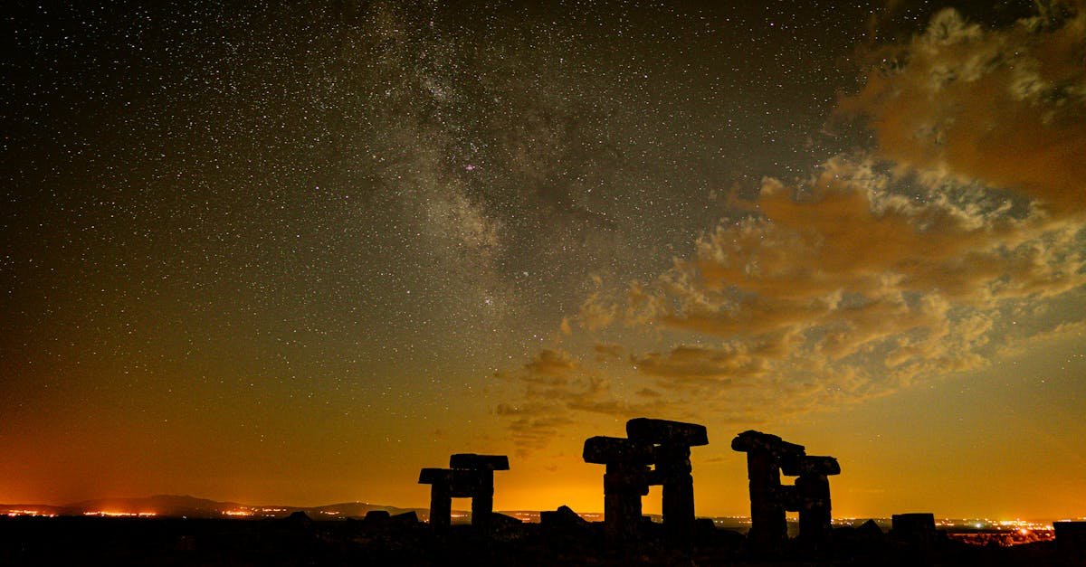 Captivating view of a starry night sky over ancient ruins in Uşak, Türkiye.