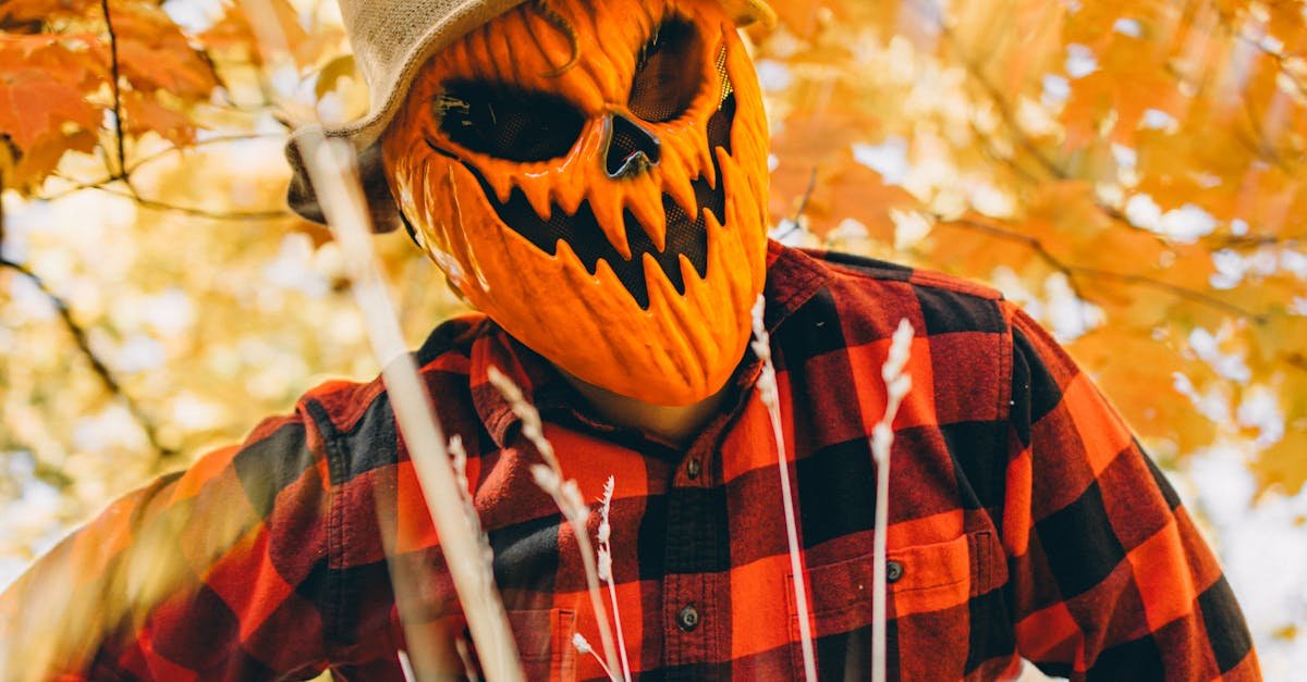 Spooky pumpkin-headed figure in red plaid shirt amidst Chicago's fall foliage, perfect for Halloween themes.