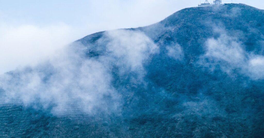A misty mountain with a remote building in Taiwan, perfect for hiking enthusiasts.