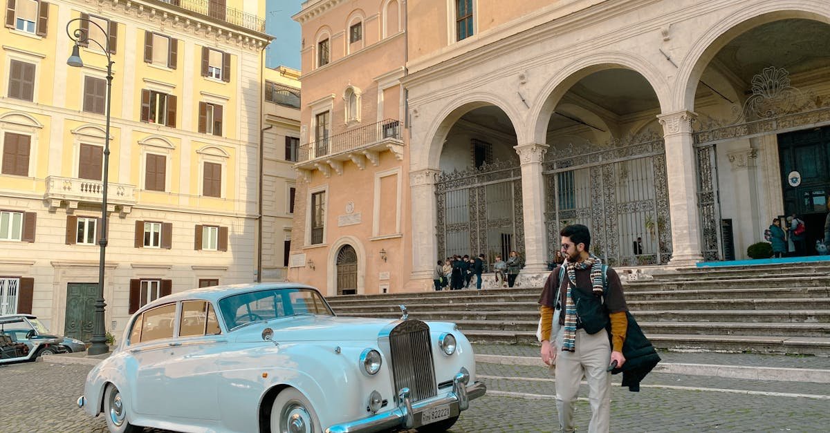 Vintage Rolls Royce parked by historic building in Florence, Italy. Captured with iPhone.