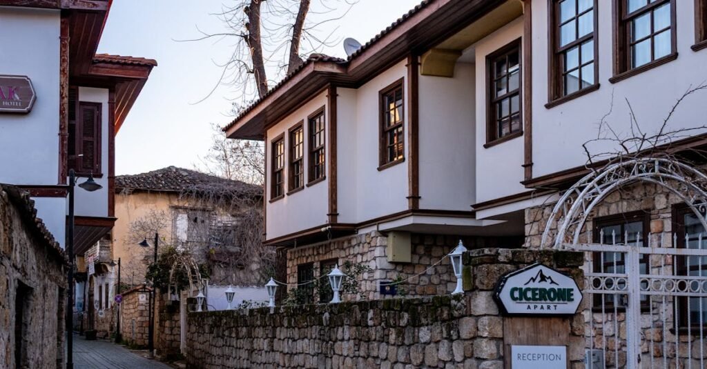 Quaint cobblestone street with vintage architecture in a historic town during daytime.