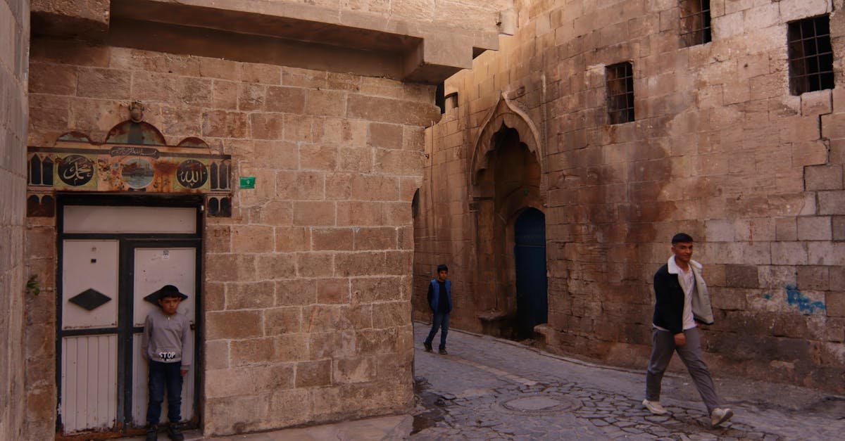 A vibrant street scene in Şanlıurfa, Türkiye capturing local life with historic architecture.
