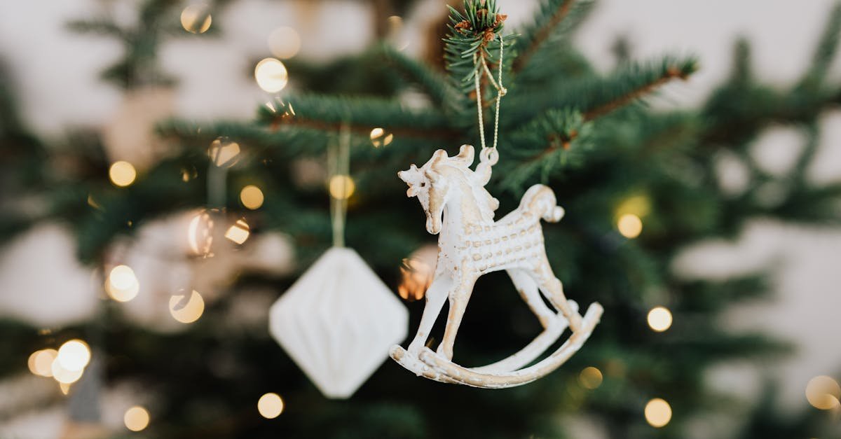 Detailed shot of a rustic horse ornament hanging on a Christmas tree. Perfect holiday decor.
