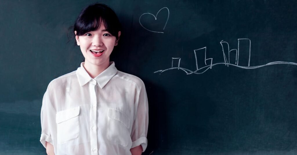 Smiling young woman stands confidently by a blackboard with chalk drawings.