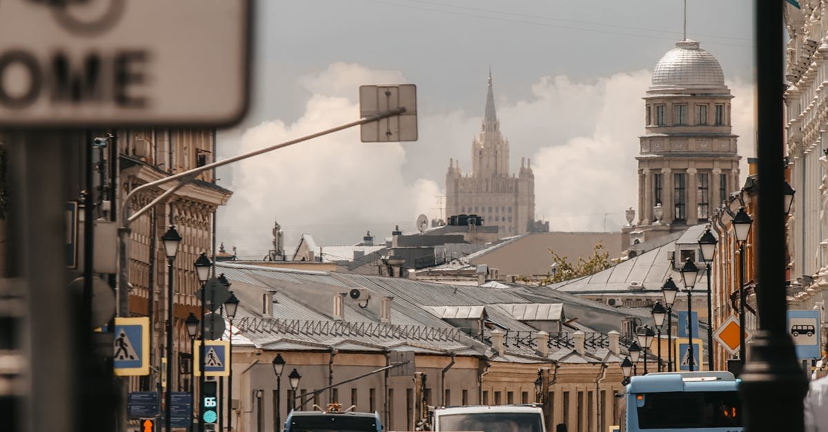 Busy Moscow city street with classic architecture and iconic buildings, filled with traffic.