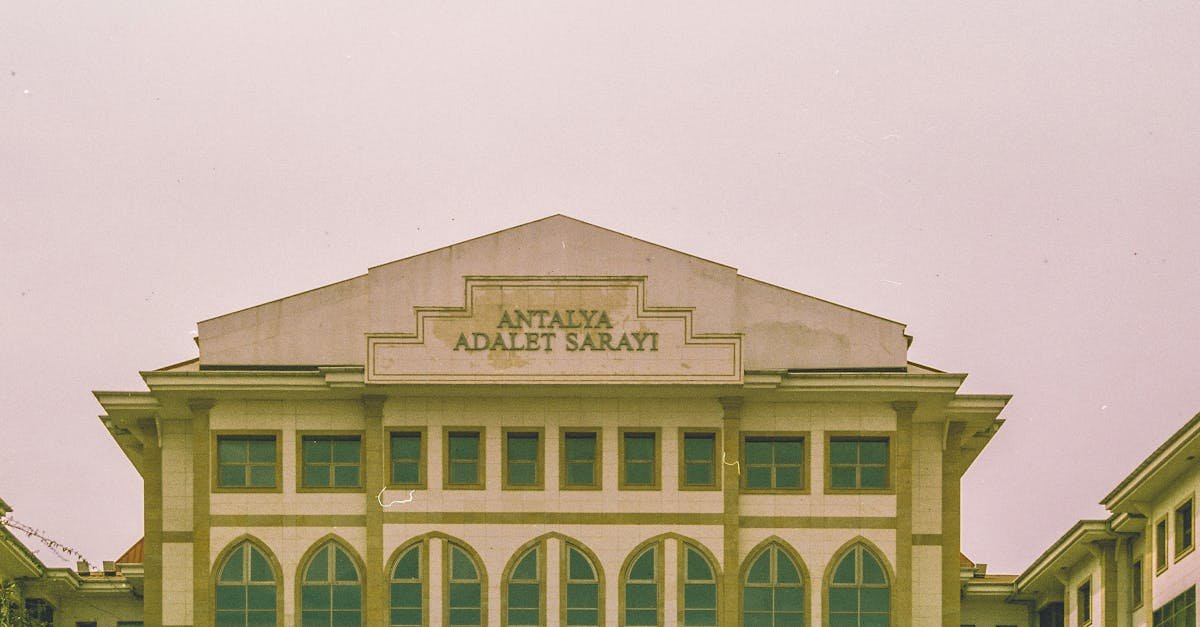 Front view of Antalya Courthouse showcasing its Gothic windows and classical architecture in Antalya, Turkey.