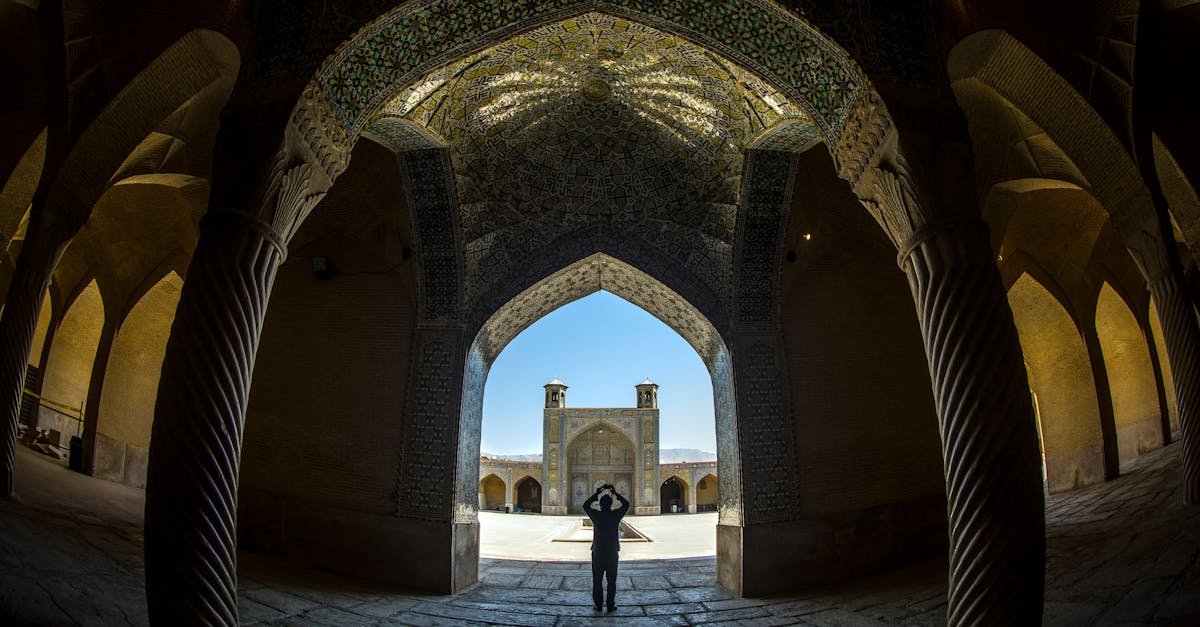 Explore the stunning arches and intricate details of the historic Vakil Mosque in Shiraz, Iran.