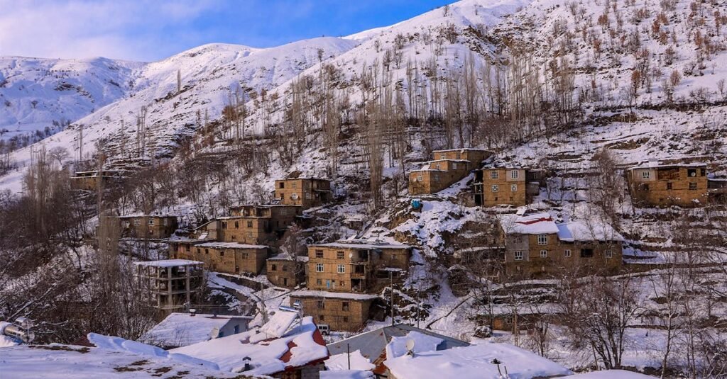 Snow-covered village in Hizan, Bitlis, Türkiye captured during winter, showcasing rustic architecture.