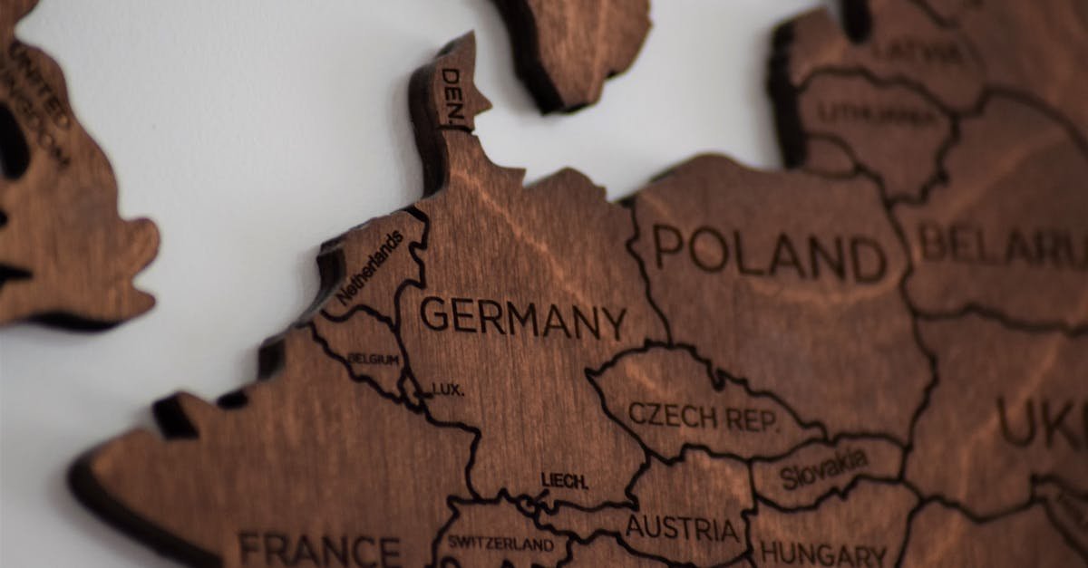 Detailed wooden map of Europe highlighting countries like Germany and Poland.