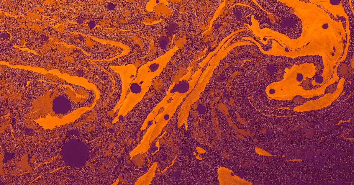 Dynamic orange and purple fluid art with a swirling pattern and rich texture.