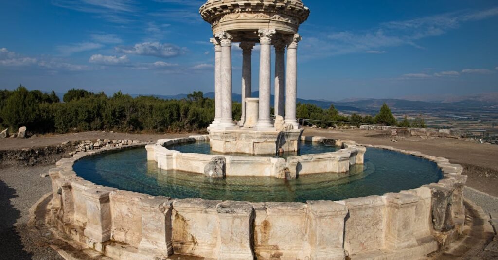 Stunning view of ancient ruins with a historic circular fountain in Turkey.