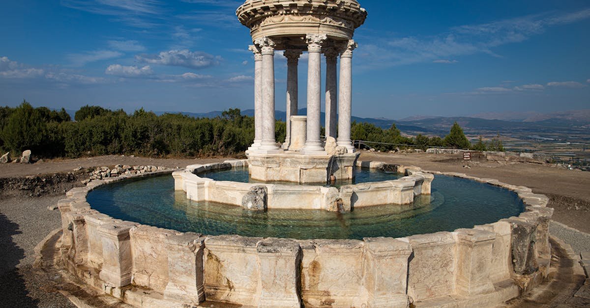 Stunning view of ancient ruins with a historic circular fountain in Turkey.