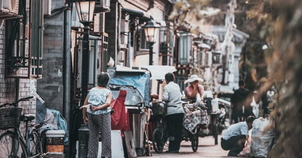 A glimpse into the vibrant street life of a traditional hutong in Beijing, China, showcasing daily interactions.