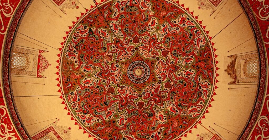 Close-up of ornate Islamic ceiling art featuring intricate geometric designs.