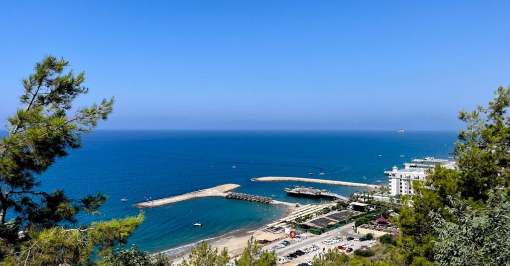 Breathtaking view of the Mediterranean coastline with a clear blue sea and lush greenery.