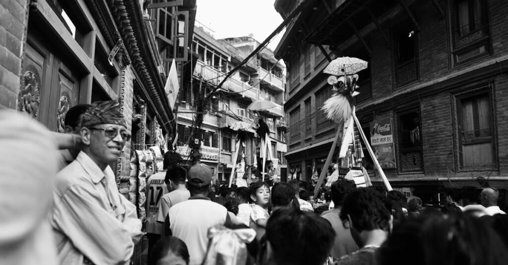 Crowded street scene during a vibrant cultural festival in Nepal.