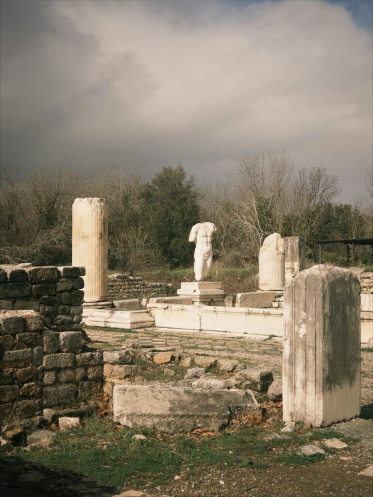 A captivating view of ancient ruins with columns in Aydın, Türkiye, under a dramatic sky.