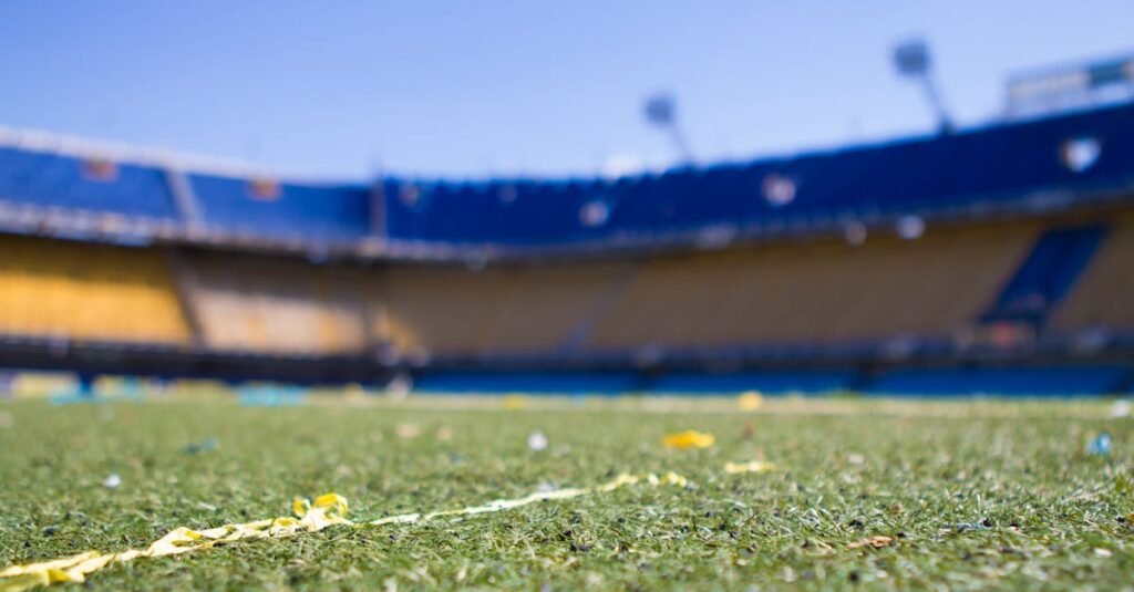 Close-up view of a vibrant football pitch in a sunlit Buenos Aires stadium, perfect for sports enthusiasts.