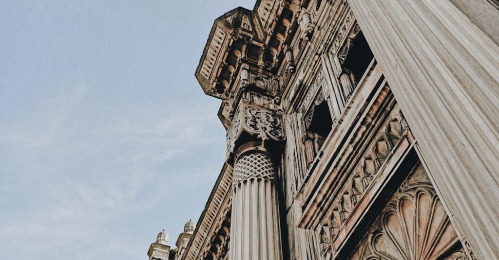 Intricate column details of an Ottoman building in Beşiktaş, Istanbul against a blue sky.