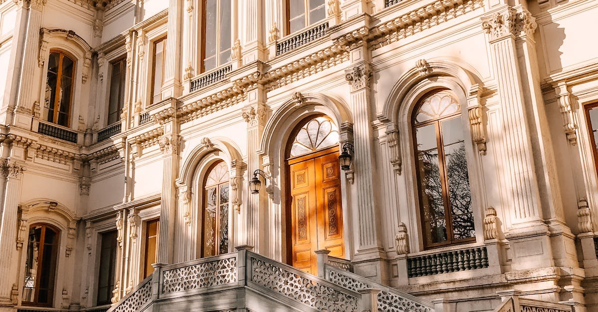 Elegant historic Ottoman style architecture with ornate details in warm sunlight.