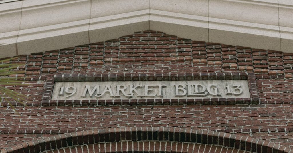 Architectural detail of a historic brick building facade with a market sign.