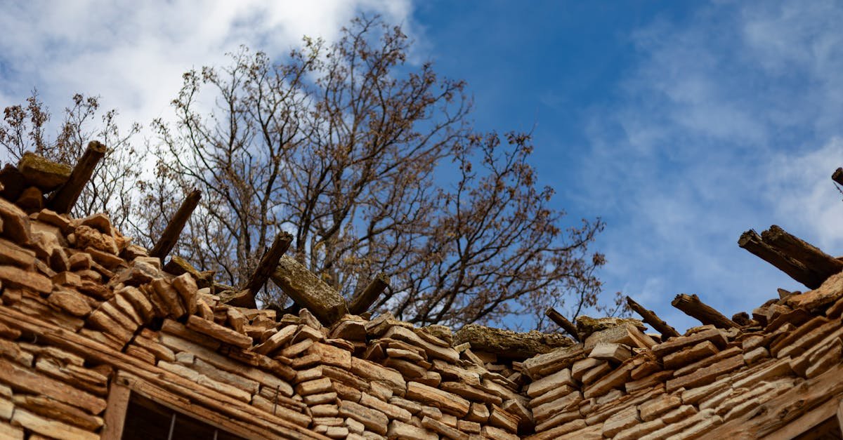 Explore the rustic charm of an old stone house with a bright blue sky in Kızılkuyu, Karaman, Türkiye.