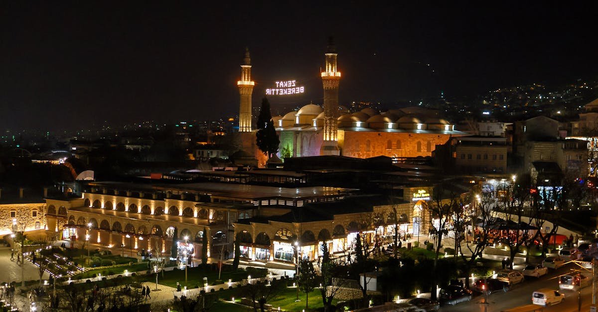 A stunning nighttime view of the Bursa Grand Mosque and surrounding area, beautifully illuminated.