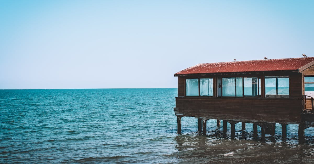 Scenic view of a wooden dock over calm ocean waters under a clear blue sky in Ordu, Türkiye.