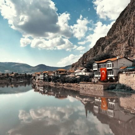 buildings beside calm body of water