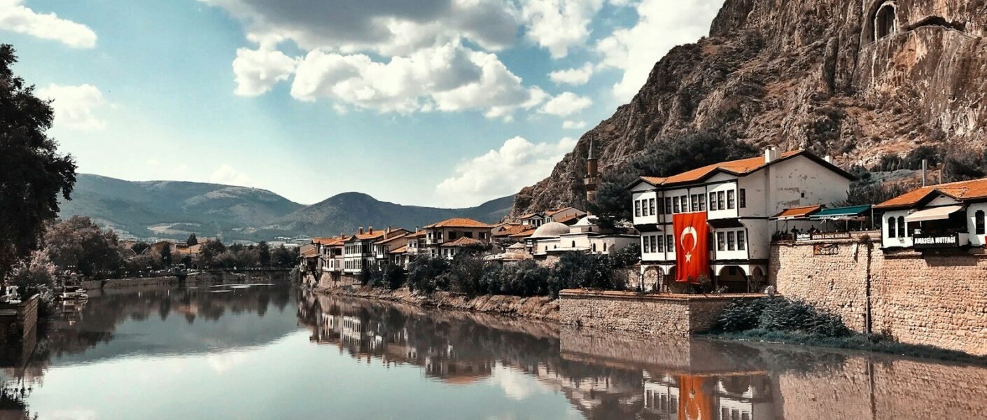 buildings beside calm body of water