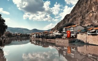buildings beside calm body of water